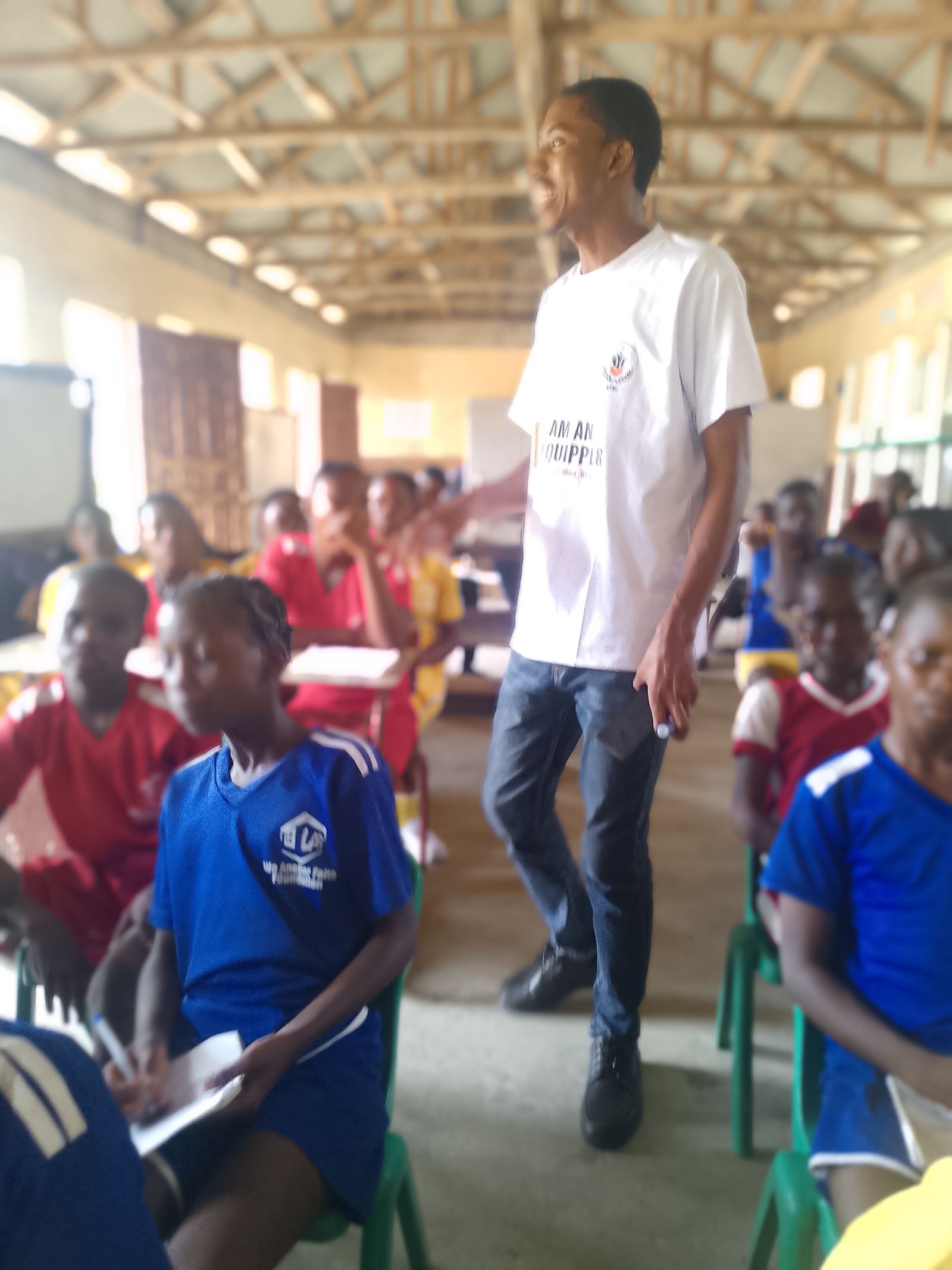 An ETSI equipper actively engaging a room full of students during a school outreach session