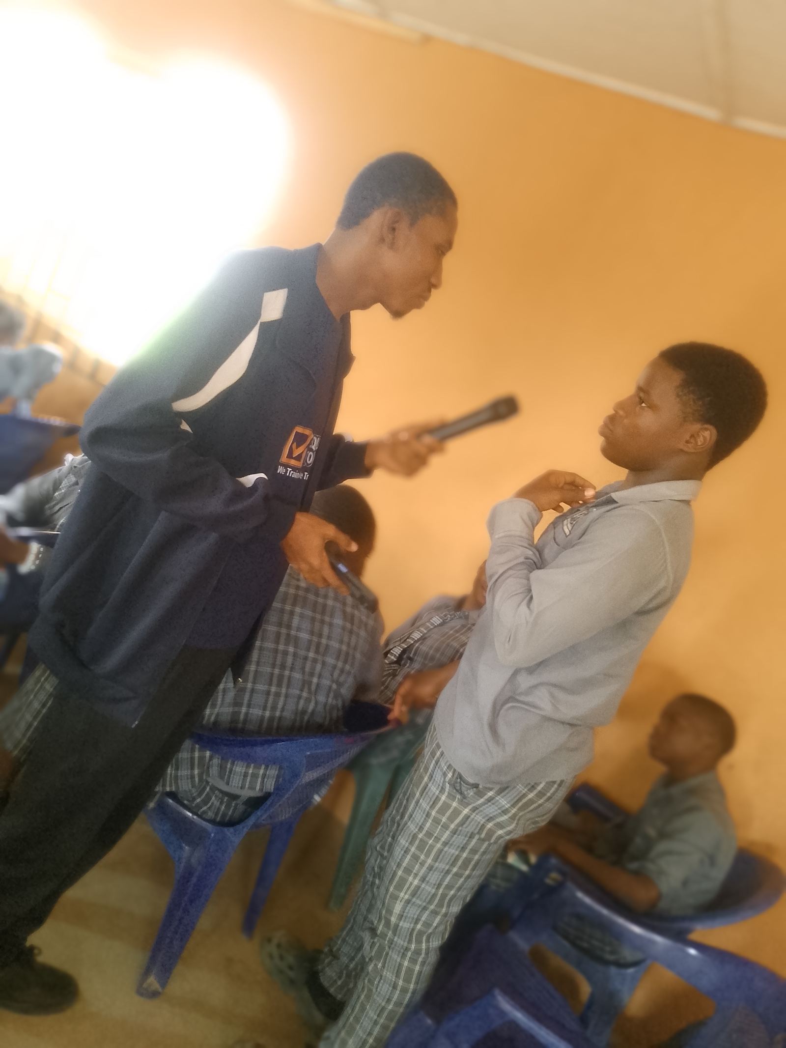 ETSI equipper interviewing a student during school outreach